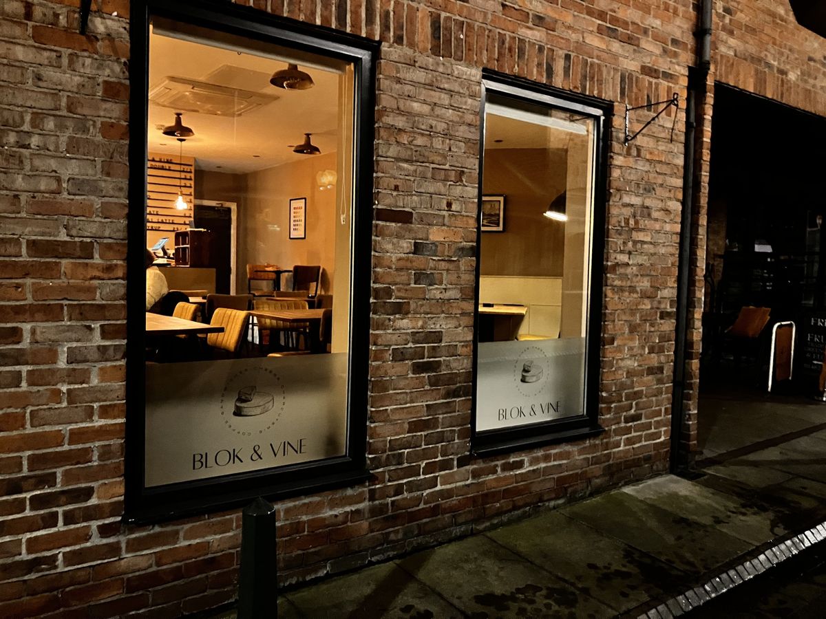 An exterior photograph of Blok and Vine in 16 Dyer Lane, Beverley, at night-time