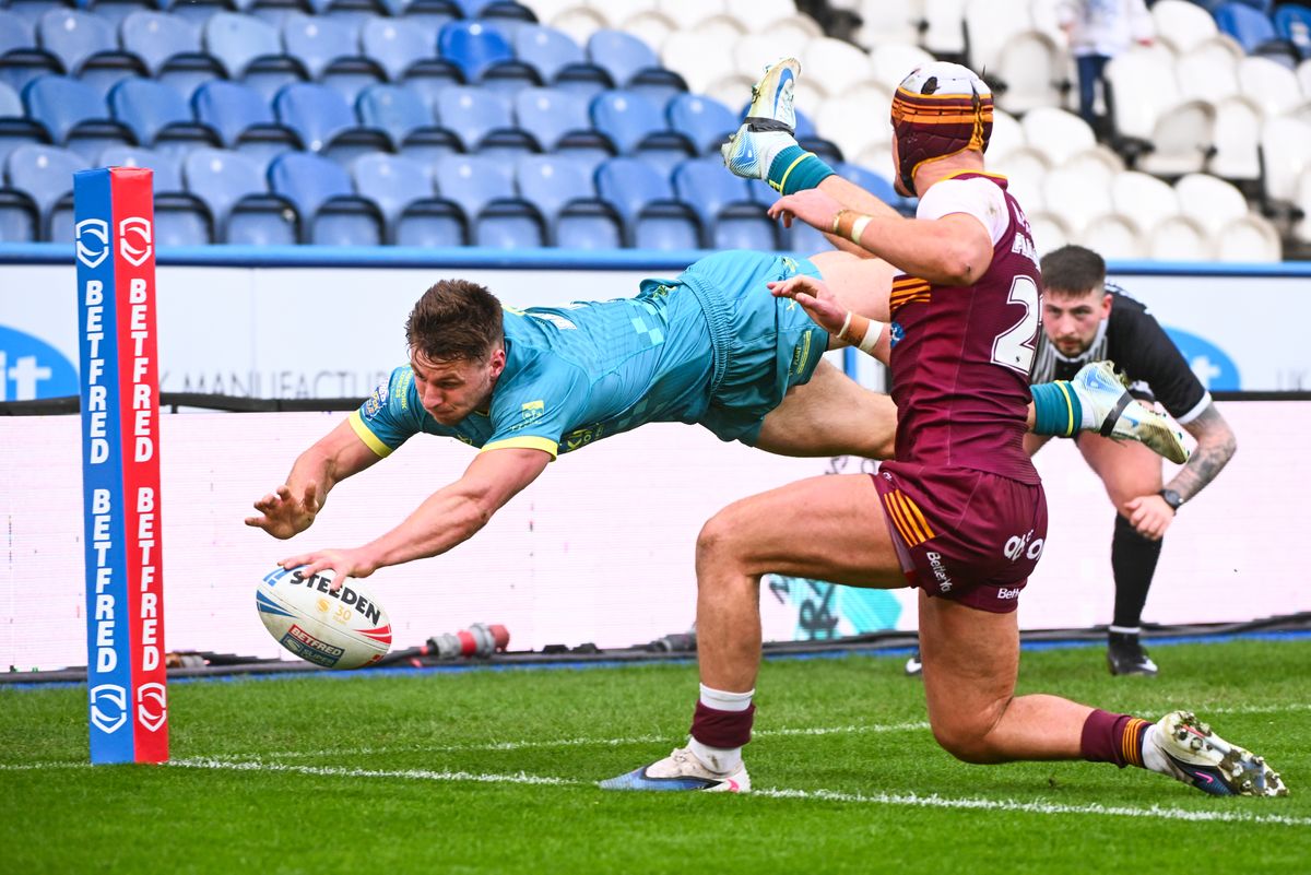 Hull KR's Tom Davies with a flying finish against Huddersfield Giants.