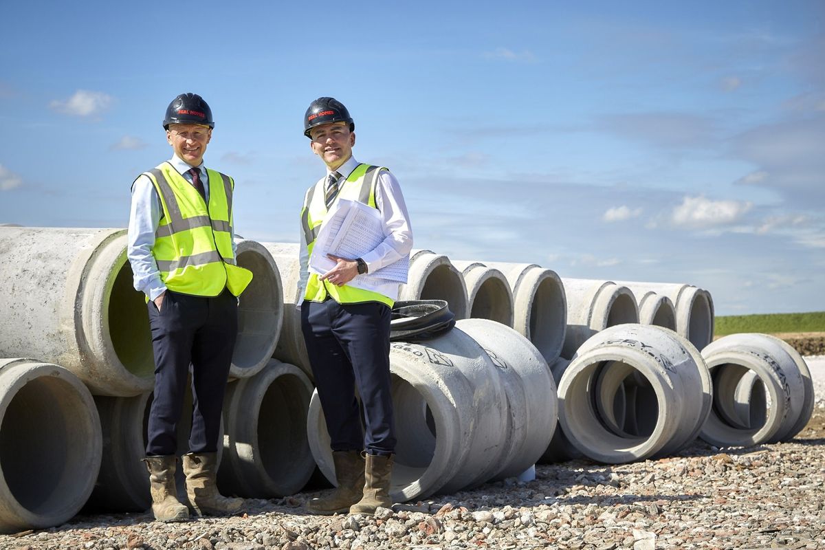 17/04/26 - Housebuilder Beal Homes beginning work to pave the way for its latest development in Hull’s popular Kingswood neighbourhood, King's Crescent. Beal Construction Director Andy Devine, left, and Sales and Marketing Director Ross Clarkson in front of sewage pipes which are being installed as part of infrastructure works for the King’s Crescent development in Kingswood, Hull.