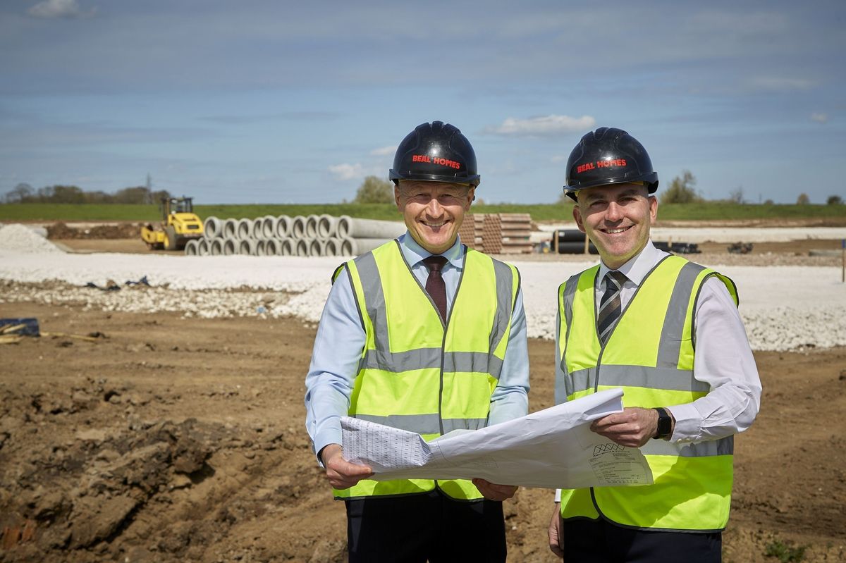 17/04/26 - Housebuilder Beal Homes beginning work to pave the way for its latest development in Hull’s popular Kingswood neighbourhood, King's Crescent. Beal Homes Construction Director Andy Devine, left, and Sales and Marketing Director Ross Clarkson look at plans for the King’s Crescent development in Hull’s popular Kingswood neighbourhood, against a backdrop of infrastructure works to pave the way for the new homes.