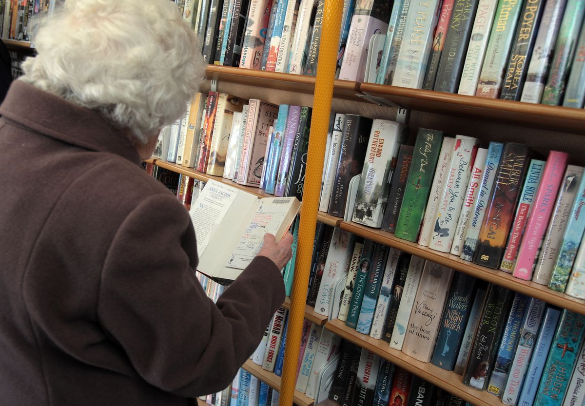 Library user browses for books (stock image)