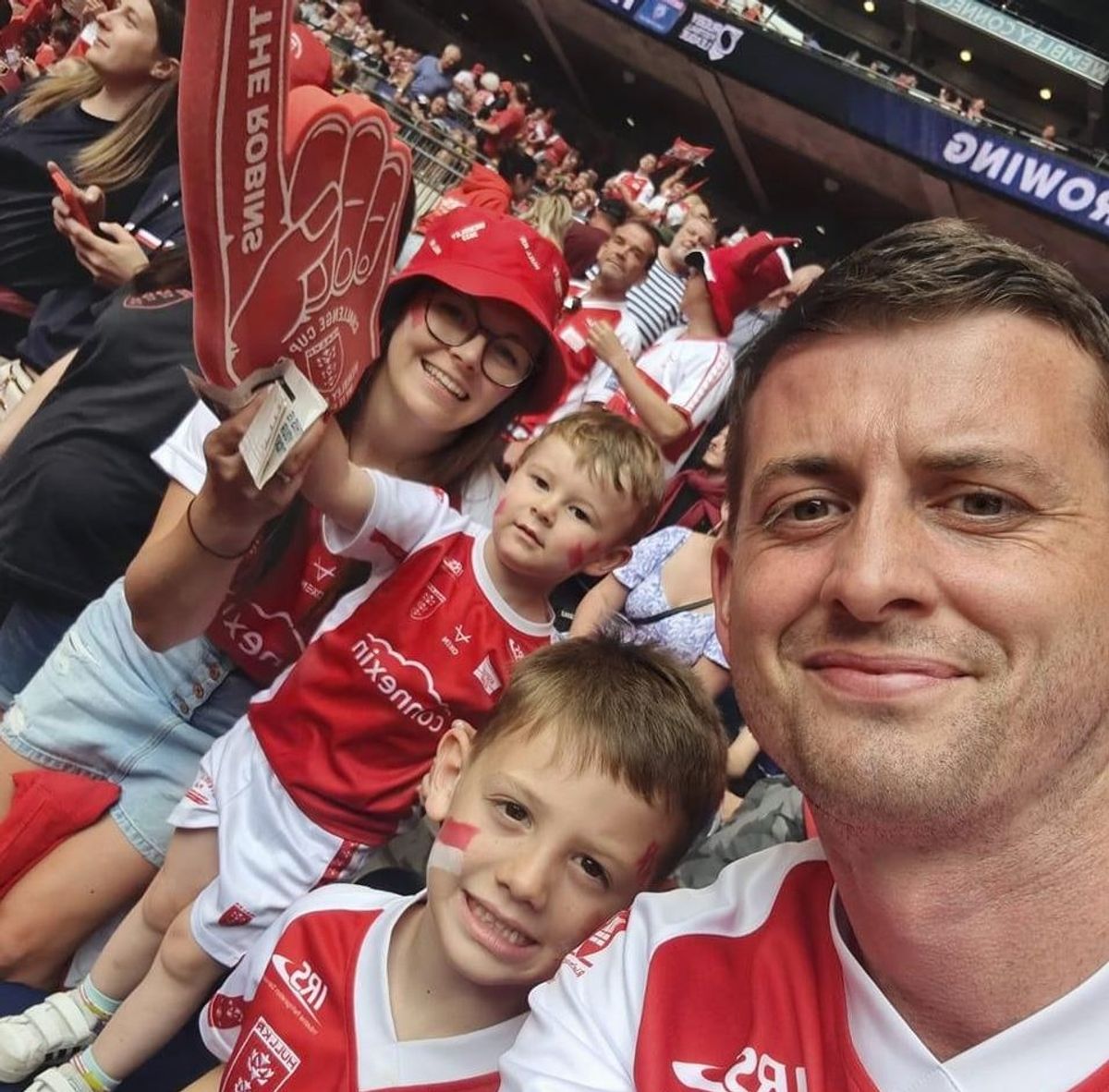 Craig Eskrett supporting Hull Kingston Rovers with his partner and two sons, age three and seven