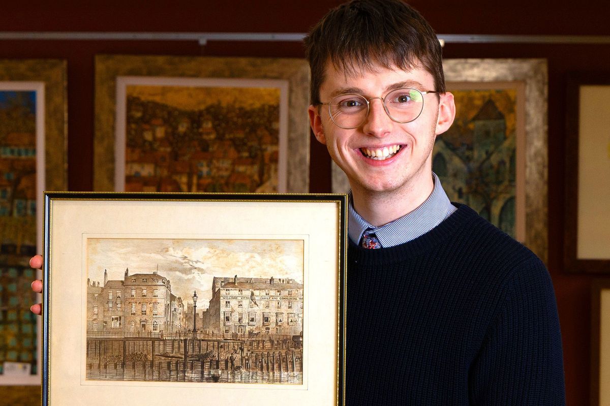 Dominic Cox, head of art at auctioneers David Duggleby, with F.S. Smith's view of the South End with work taking place on the 'New Pier' in Hull