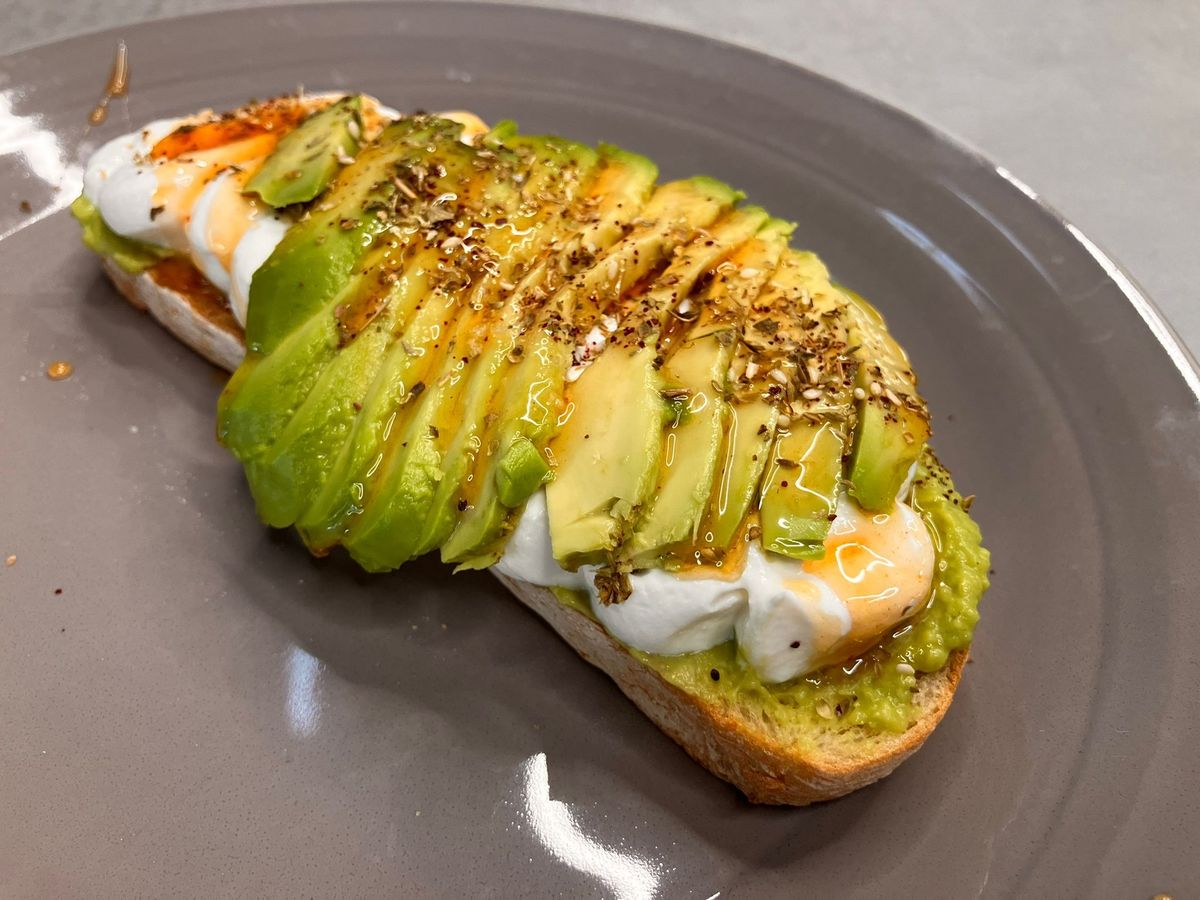 Fresh avocado glistening under a thick layer of honey