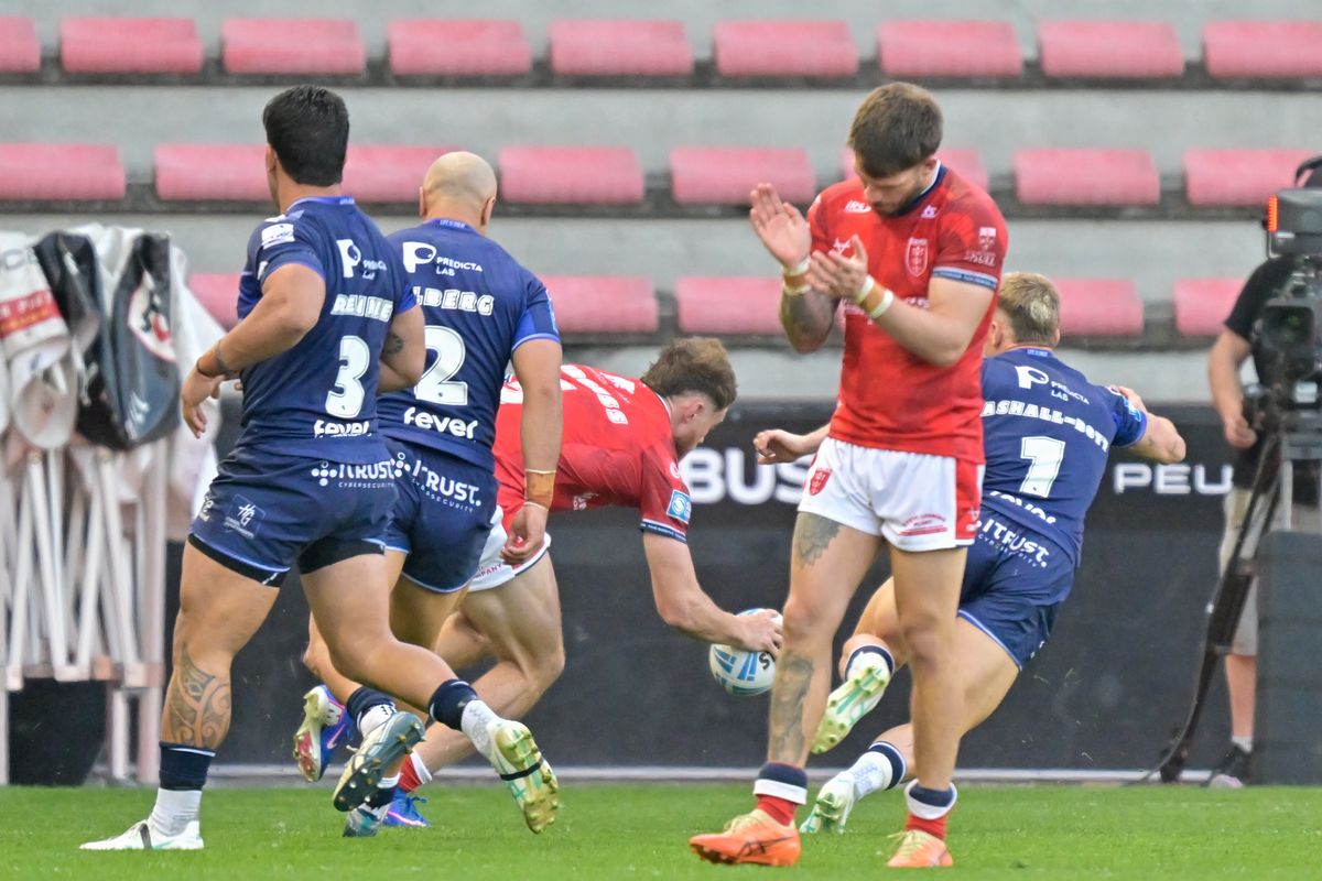 Oliver Gildart celebrates as Joe Burgess crosses for a try against Toulouse Olympique. 