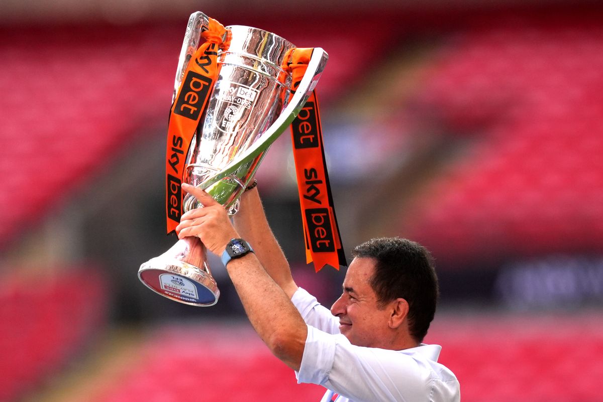 Hull City owner Acun Ilicali lifts the play-off final trophy at Wembley