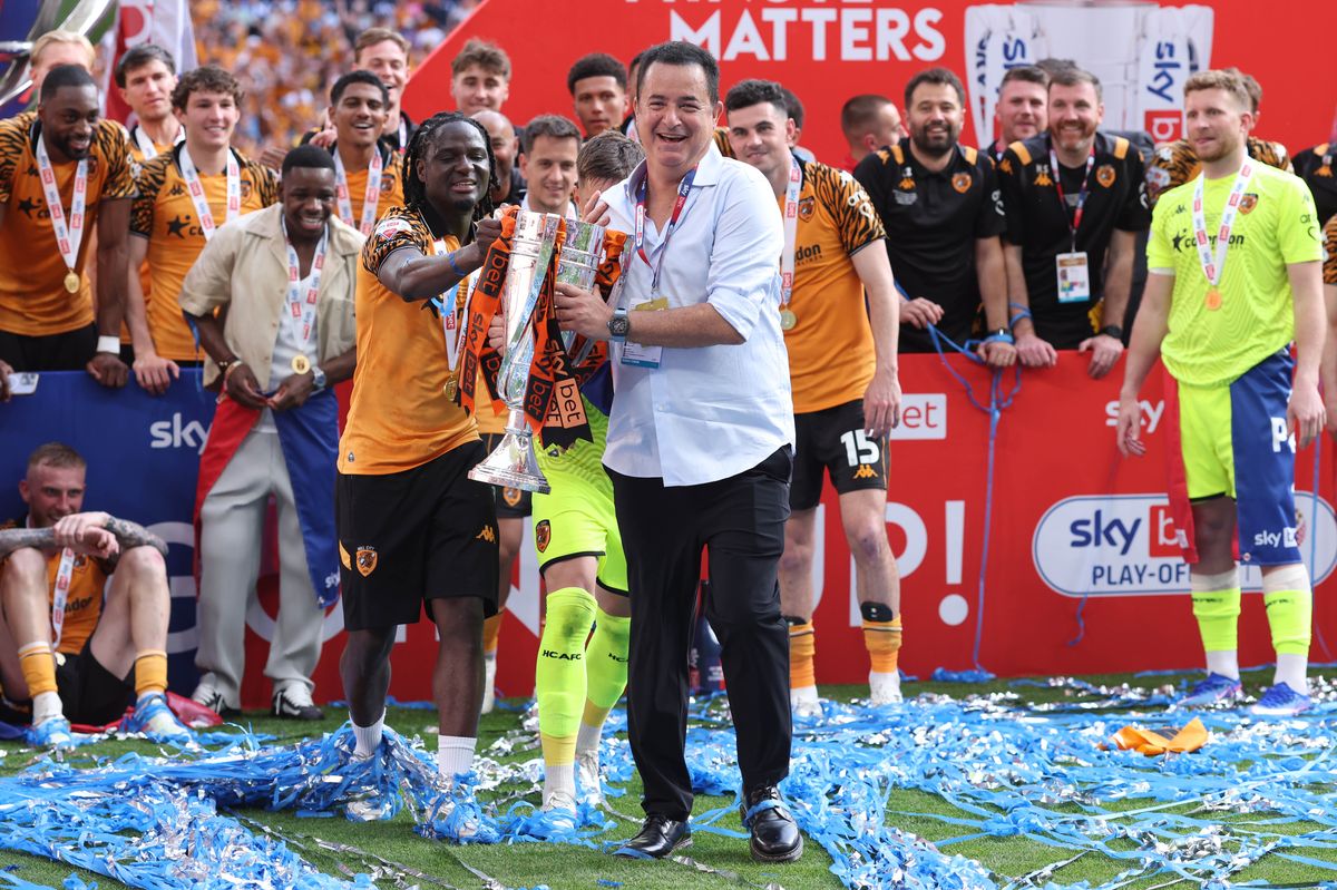 Hull City owner Acun Ilicali celebrates promotion with David Akintola and the Tigers' players at Wembley