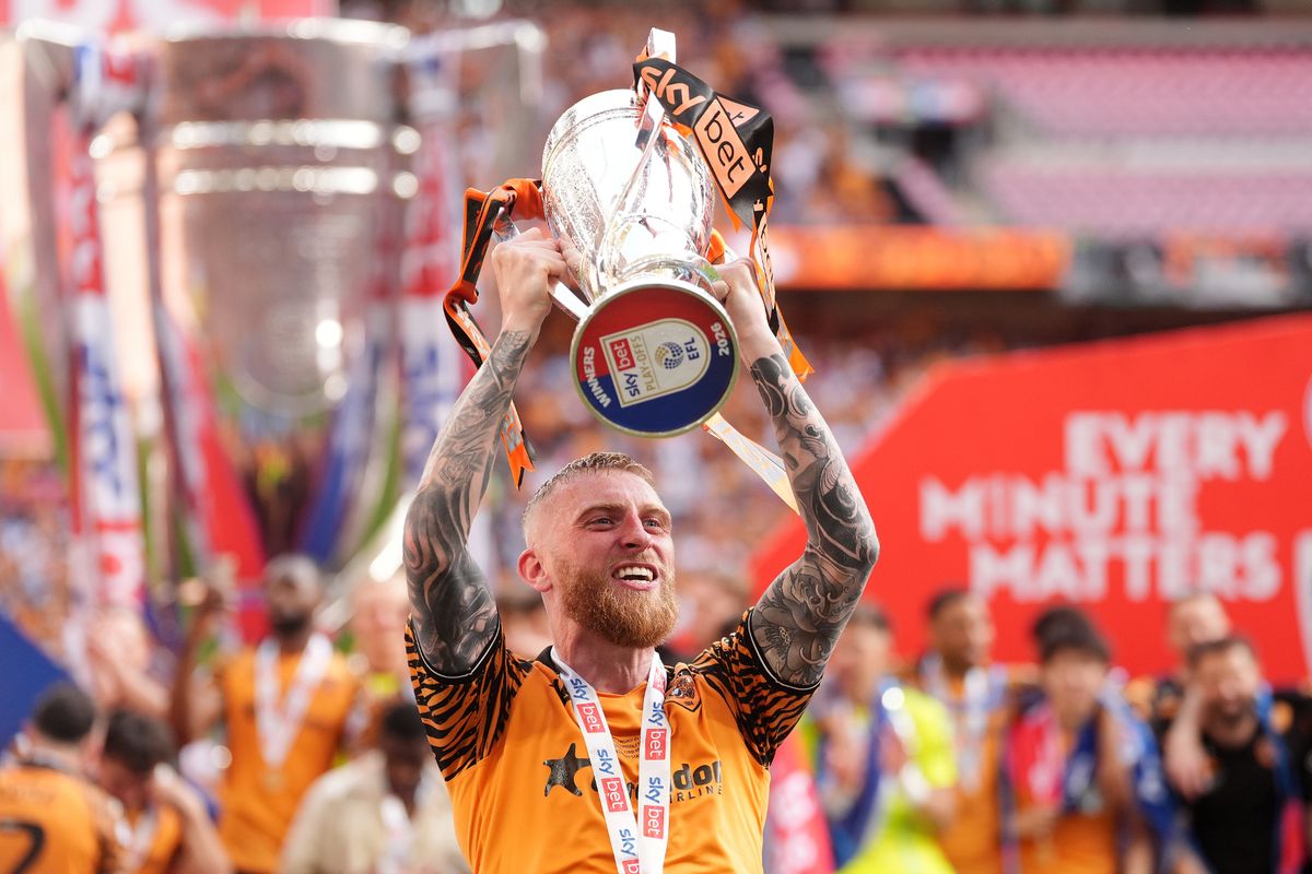 Hull City's Oliver McBurnie celebrates with the trophy after winning promotion to the Premier League
