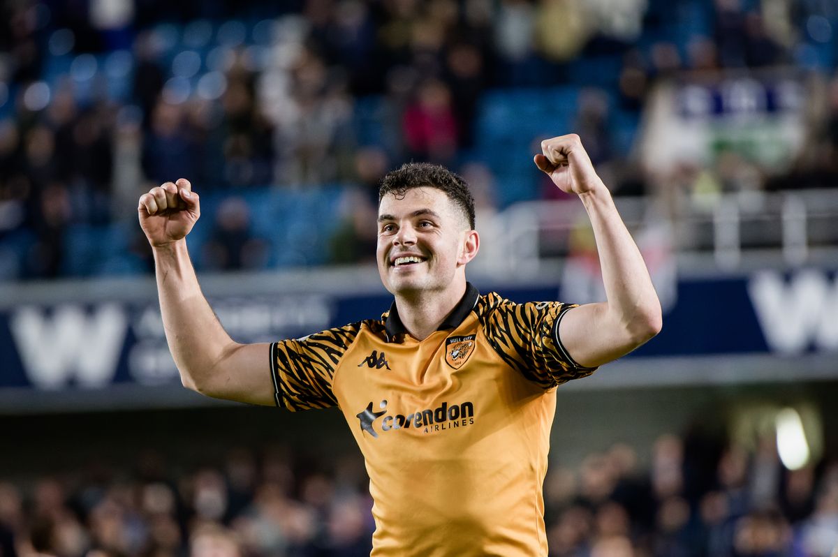 John Egan celebrates the win at Millwall on Monday night