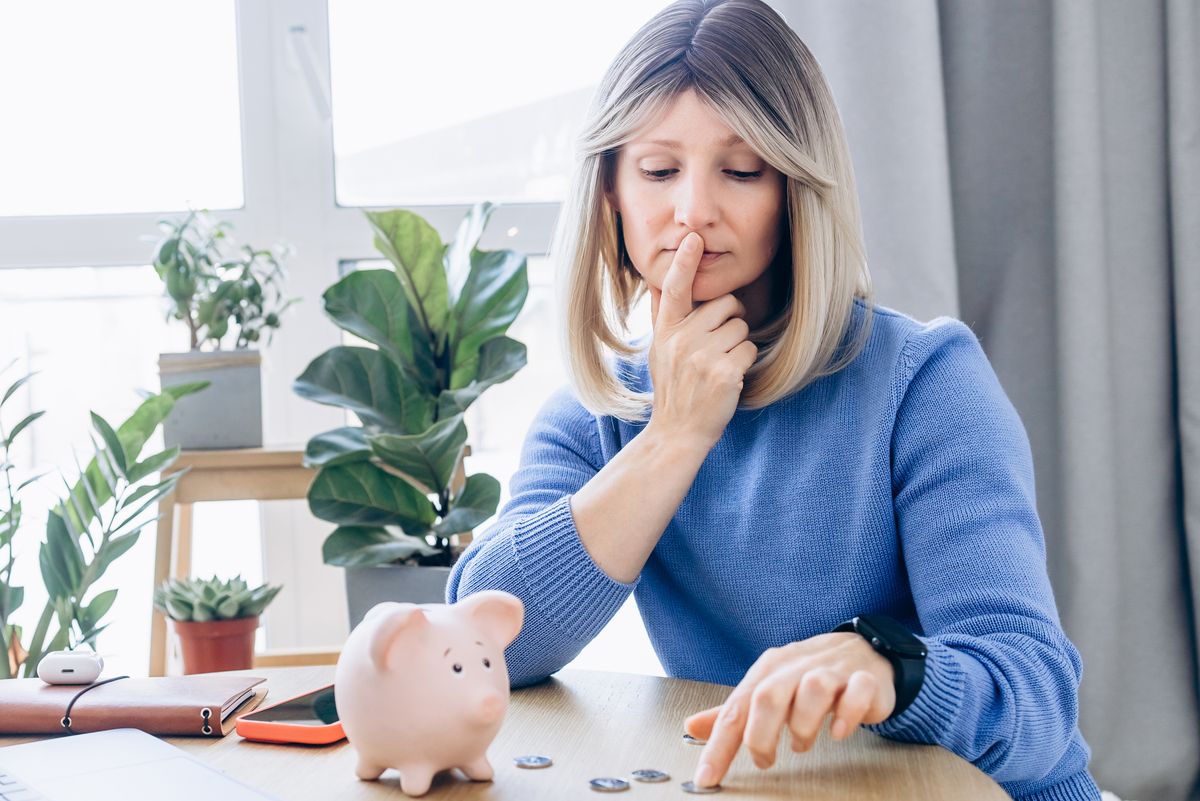 Woman looking at coins