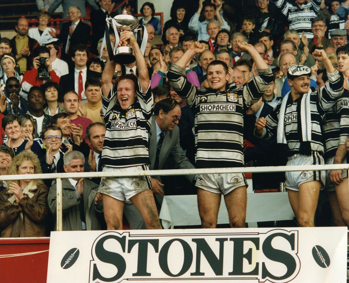 Hull FC skipper, the late Greg Mackey, lifts the Premiership trophy alongside Lee Jackson and Richard Gay.