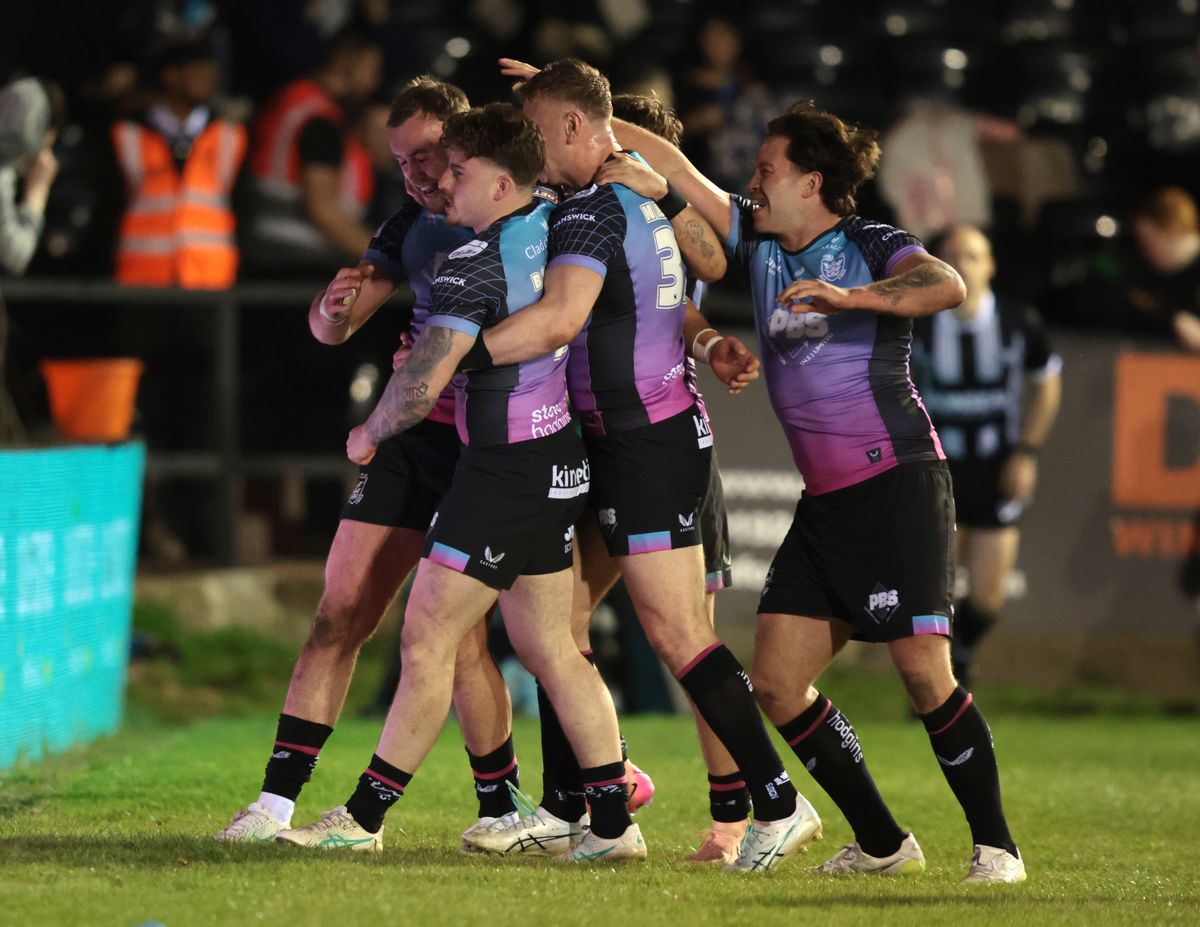 Hull FC celebrate Connor Bailey's try.