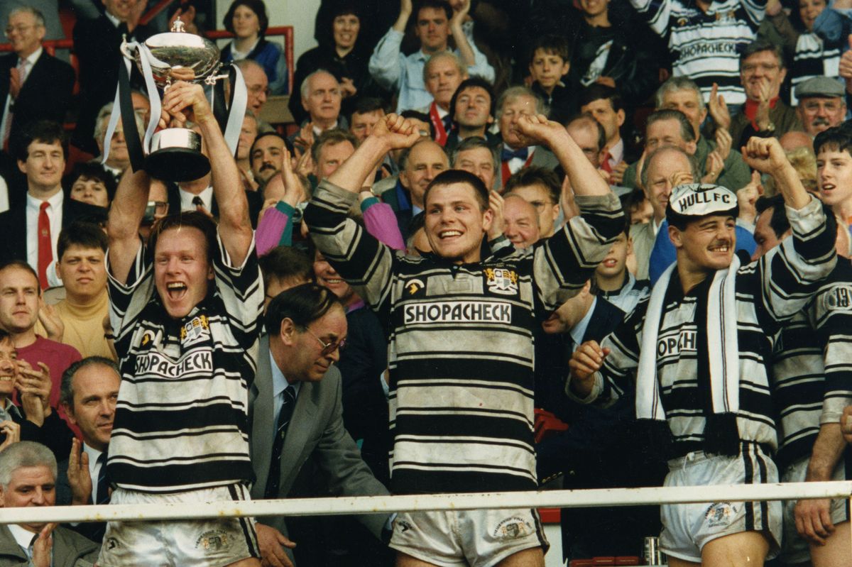 Hull FC skipper, the late Greg Mackey, lifts the Premiership trophy alongside Lee Jackson and Richard Gay.