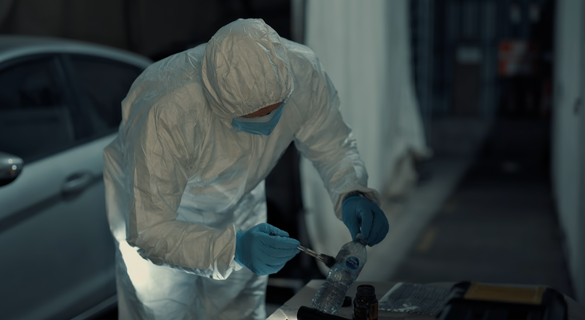 A CSI worker examines the scene on Murder Suspect