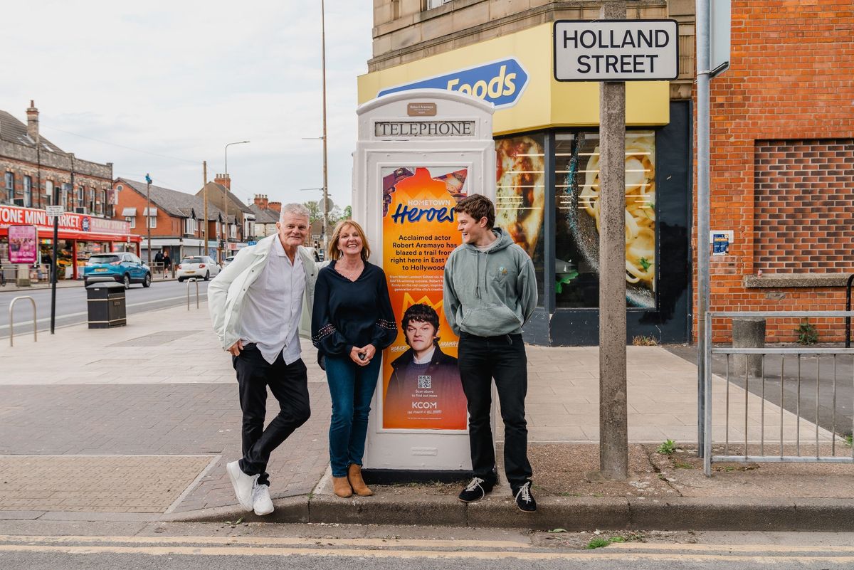 Robert Aramayo pictured with his parents Mike Aramayo and Lisa Dawson outside his dedicated phone kiosk