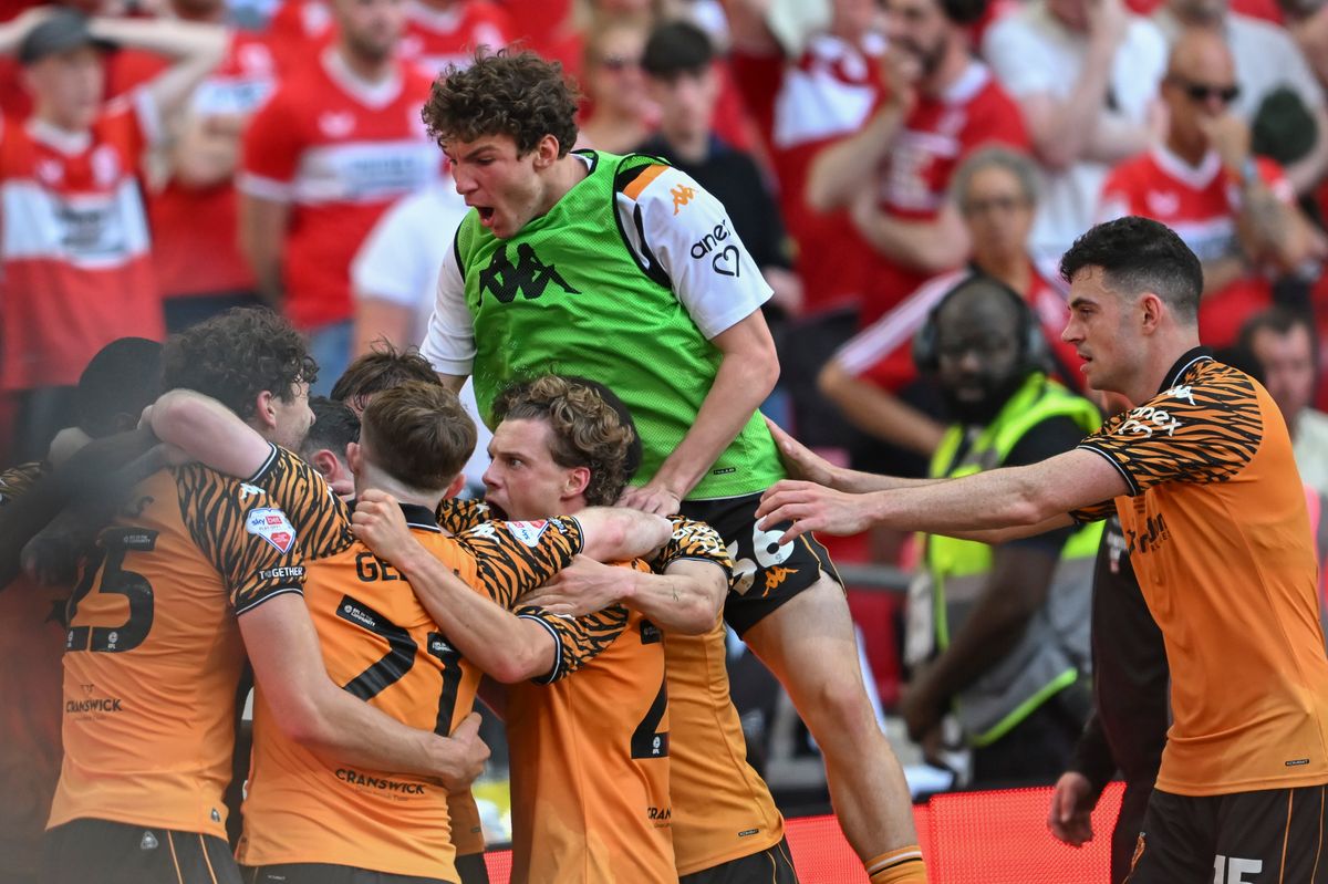 Hull City's players surround Oliver McBurnie after he scored the winner at Wembley