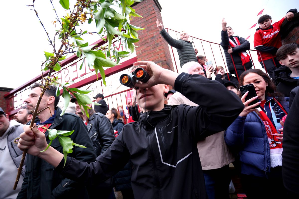 A fan is seen using binoculars outside the stadium prior to the Sky Bet Championship Play Off Semi Final Second Leg match between Middlesbrough and Southampton at Riverside Stadium on May 09, 2026 in Middlesbrough, England.
