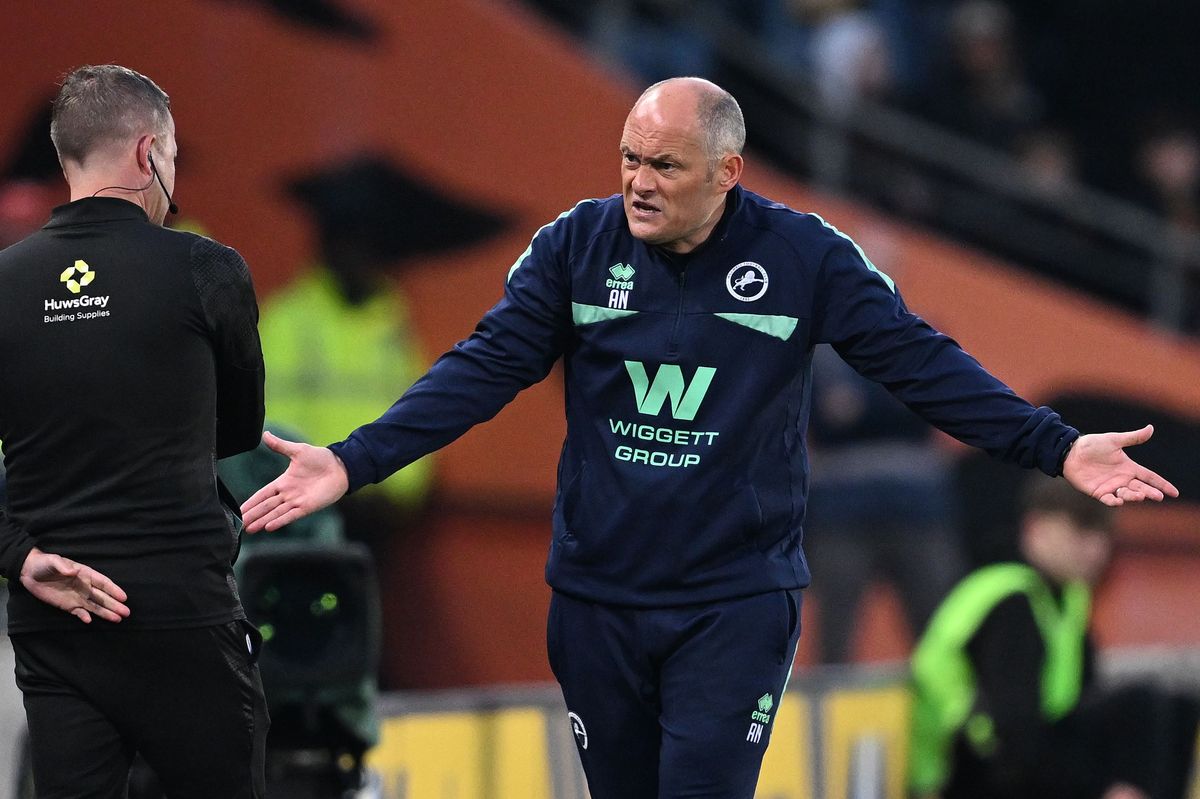 Alex Neil in conversation with the fourth official at the MKM Stadium