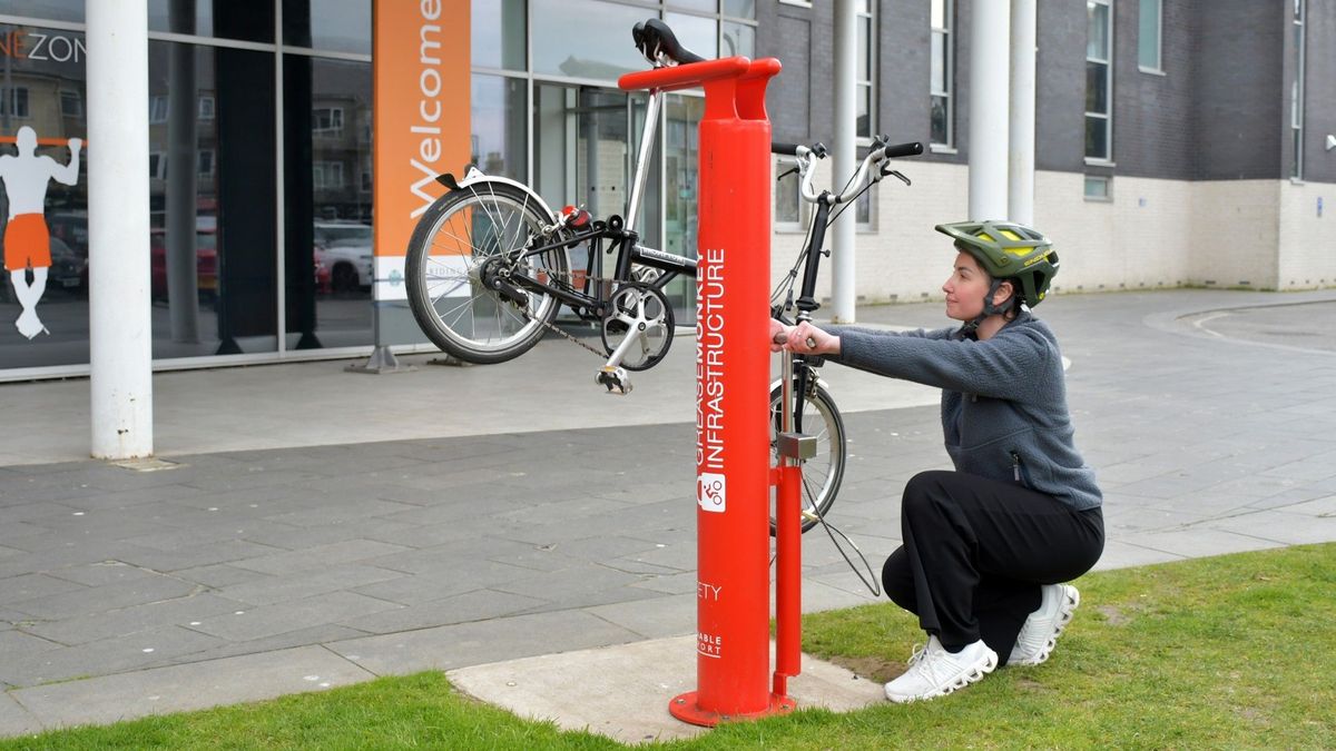 Hayley Crawford, customer service assistant at East Riding Leisure Bridlington, using the new cycle repair station