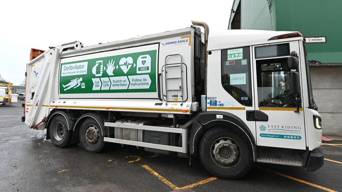East Riding of Yorkshire Council bin lorry, clearly marked to show a defibrillator is on board