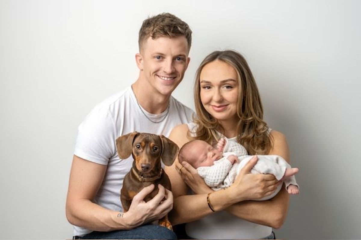 Ella Burton and Keiron Sparkes with baby Otto and family pet Nugget