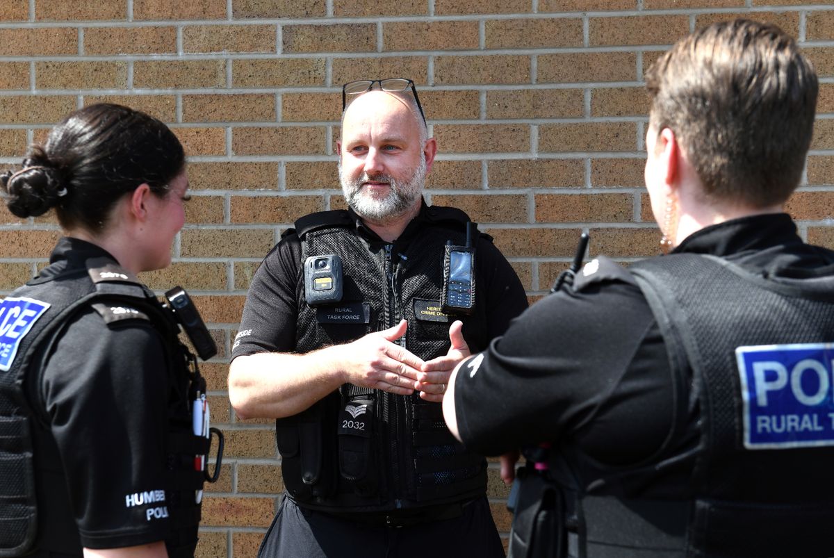 Humberside Police Rural Task Force Sergeant Paul Burnett talks through the plan for the afternoon with Rural Task Force police officers