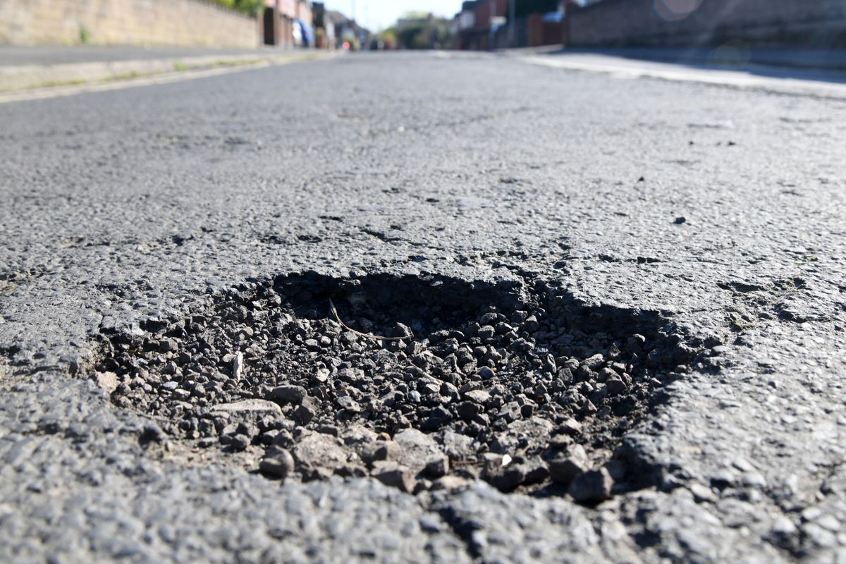 A pothole on a residential street (stock image)