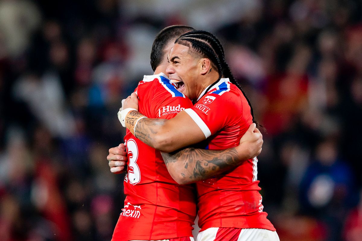 Hull KR's Elliot MInchella is congratulated by Tom Amone after scoring a try against Brisbane Broncos.