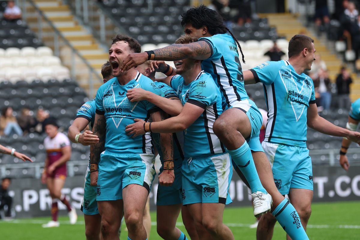 Hull FC celebrate a try against Huddersfield.