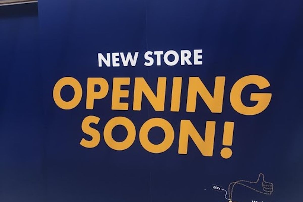Signage advertising new storefront of H&T Pawnbrokers in the North Point Shopping Centre