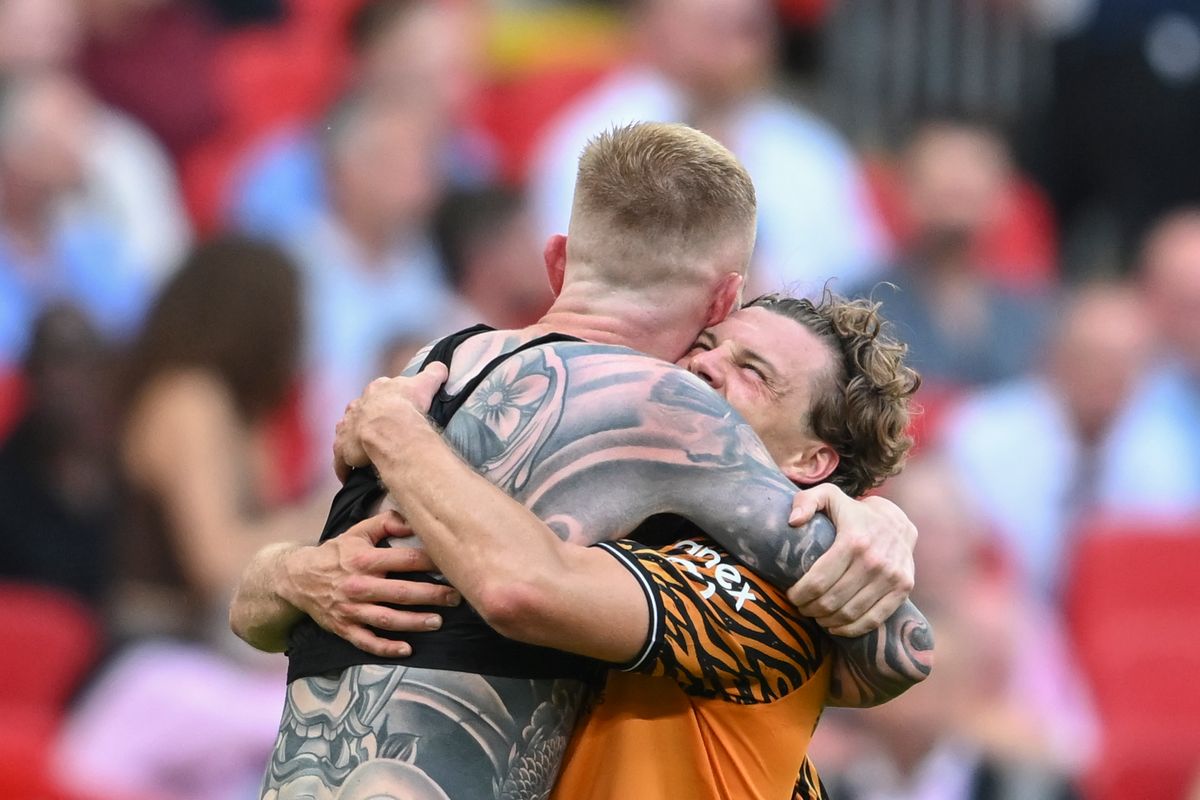 Oli McBurnie is hugged by Regan Slater at Wembley
