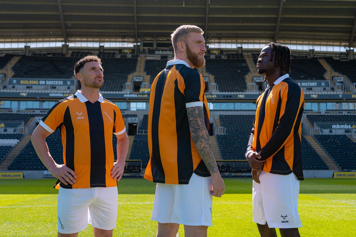 Lewie Coyle, Oli McBurnie and Darko Gyabi in Hull City's new home kit 