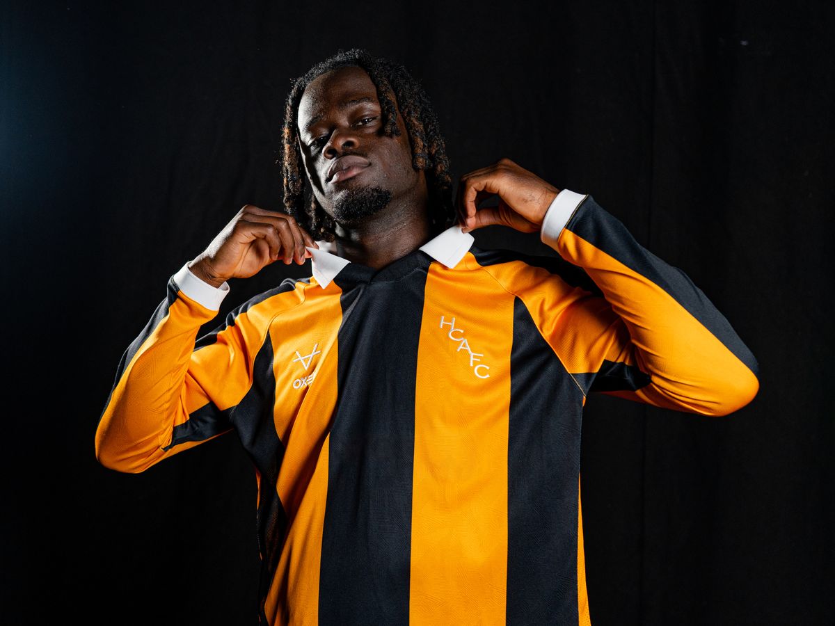 Darko Gyabi modelling the new home shirt 
