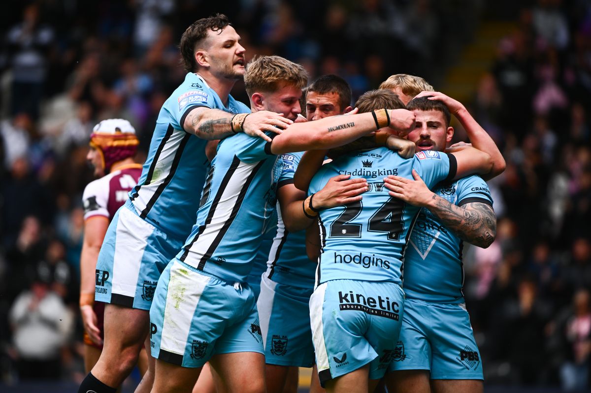 Hull FC celebrate Logan Moy's try. 
