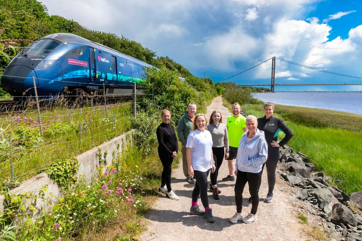 Some of the Hull Trains team who will be taking on the challenge pictured as the Hull Trains Jean Bishop ‘The Bee Lady Day’ train passes them