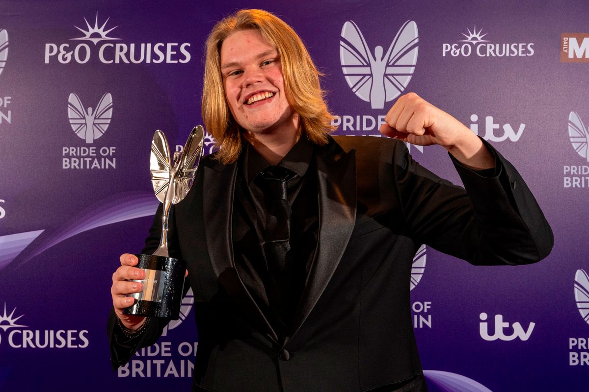 Special Recognition winner Marcus Skeet is presented his award by Anne-Marie, Sam Thompson and Pete Wicks at the Daily Mirror Pride of Britain Awards