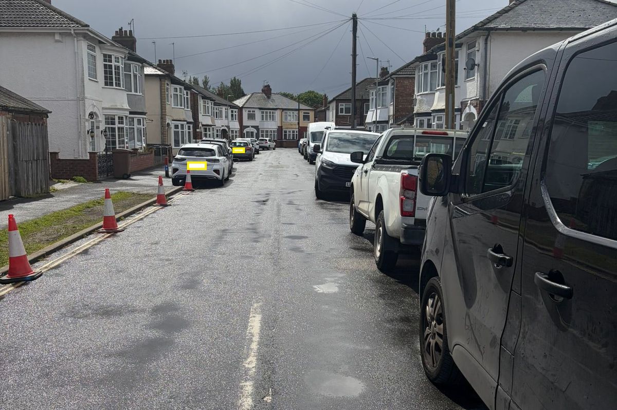 Cars and cones line both sides of the street on Princes Avenue, near Hessle Square