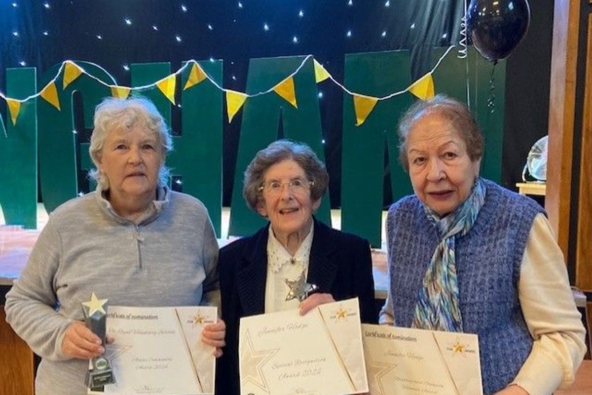 Jennifer Hodge (centre) has been celebrated for her weekly efforts volunteering at the same Royal Voluntary Service lunch club she first joined almost 50 years ago