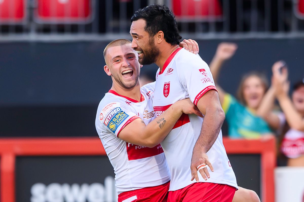 Hull KR's Mikey Lewis celebrates a try with Peta Hiku.