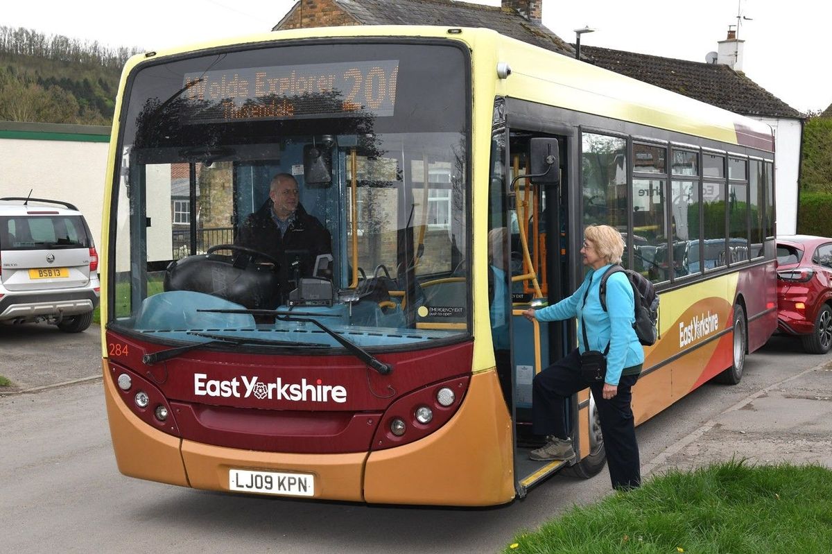 Hop on the Wolds Explorer bus, pictured here stopping in the village of Millington