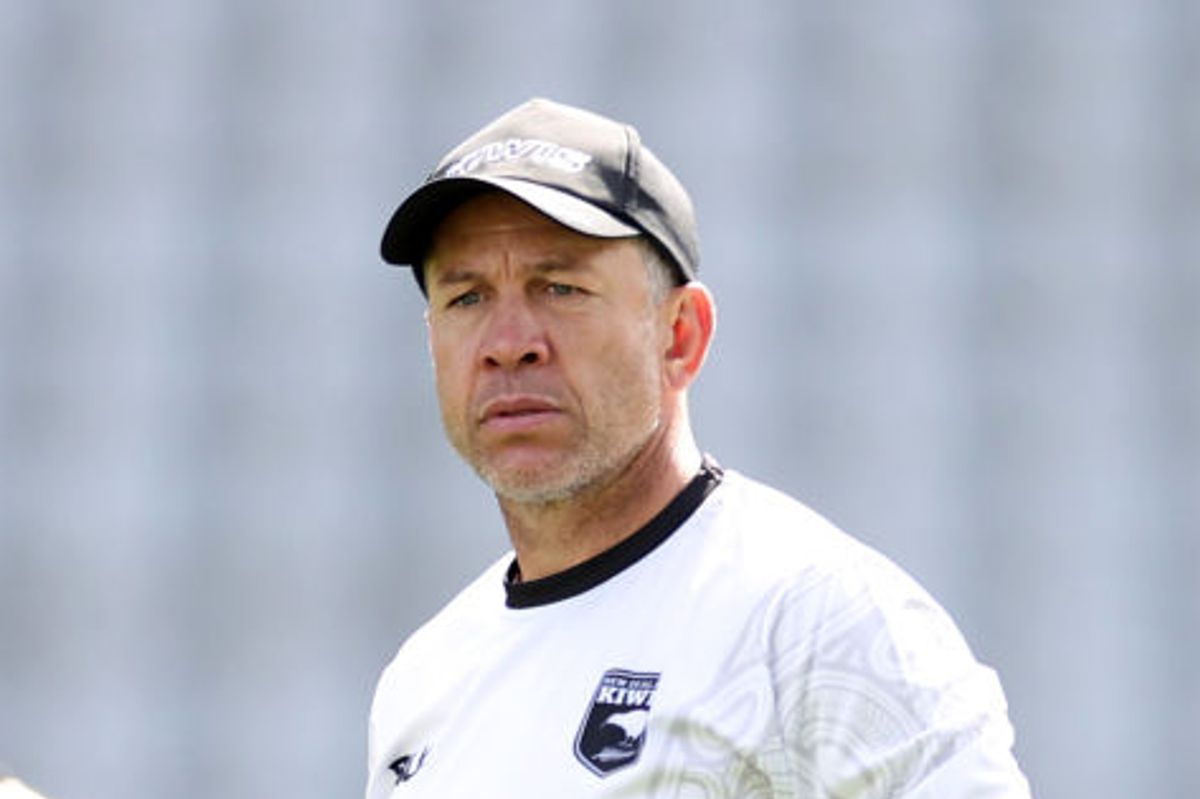 Man seen looking off into the distance at a rugby training ground 