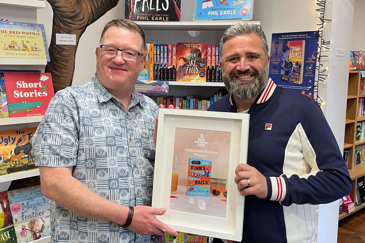 Phil Earle (right) with his award in the Children's Fiction category for Finn's Epic Fails