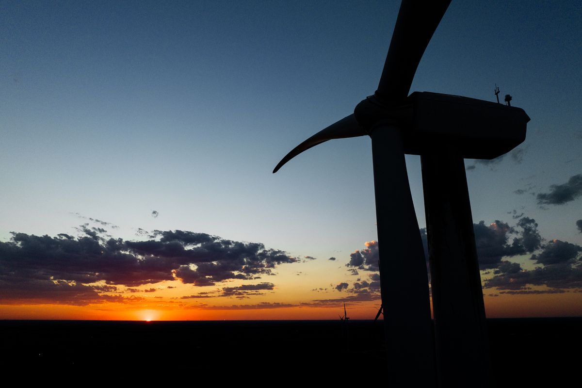 A wind turbine at sunset; a turbine up to 149.9m tall to tip is to be built at the Port of Immingham