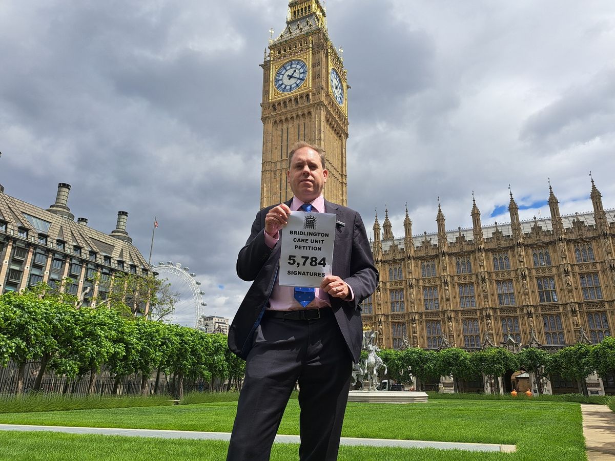 Charlie Dewhirst MP with his petition in Westminster