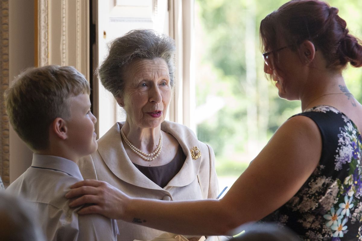 Award-winning mum and son, Kat and Theo, with the Princess Royal, centre, at Hotham Hall
