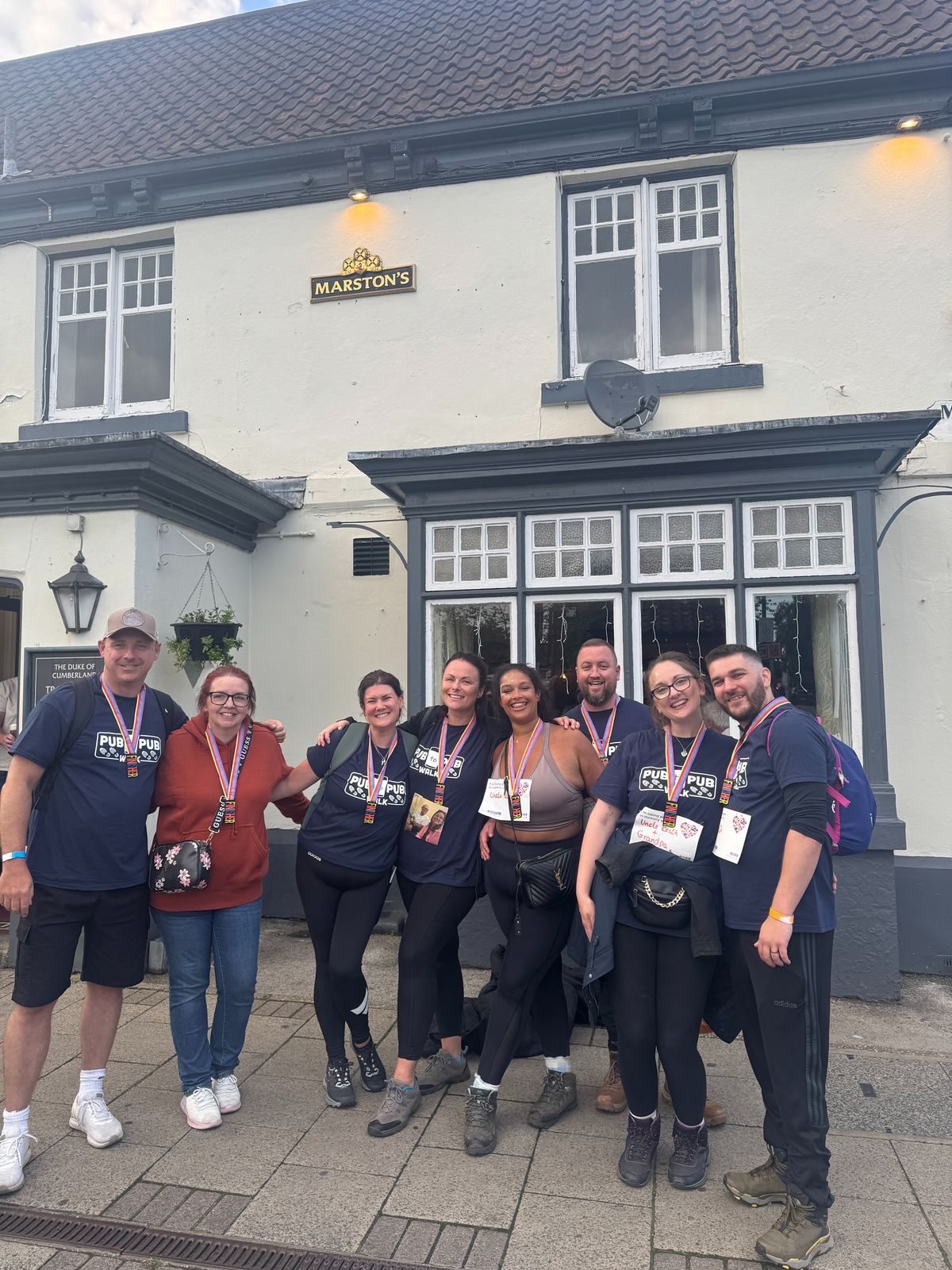 A group of eight walkers who took part in the fundraising walk for Dove House Hospice