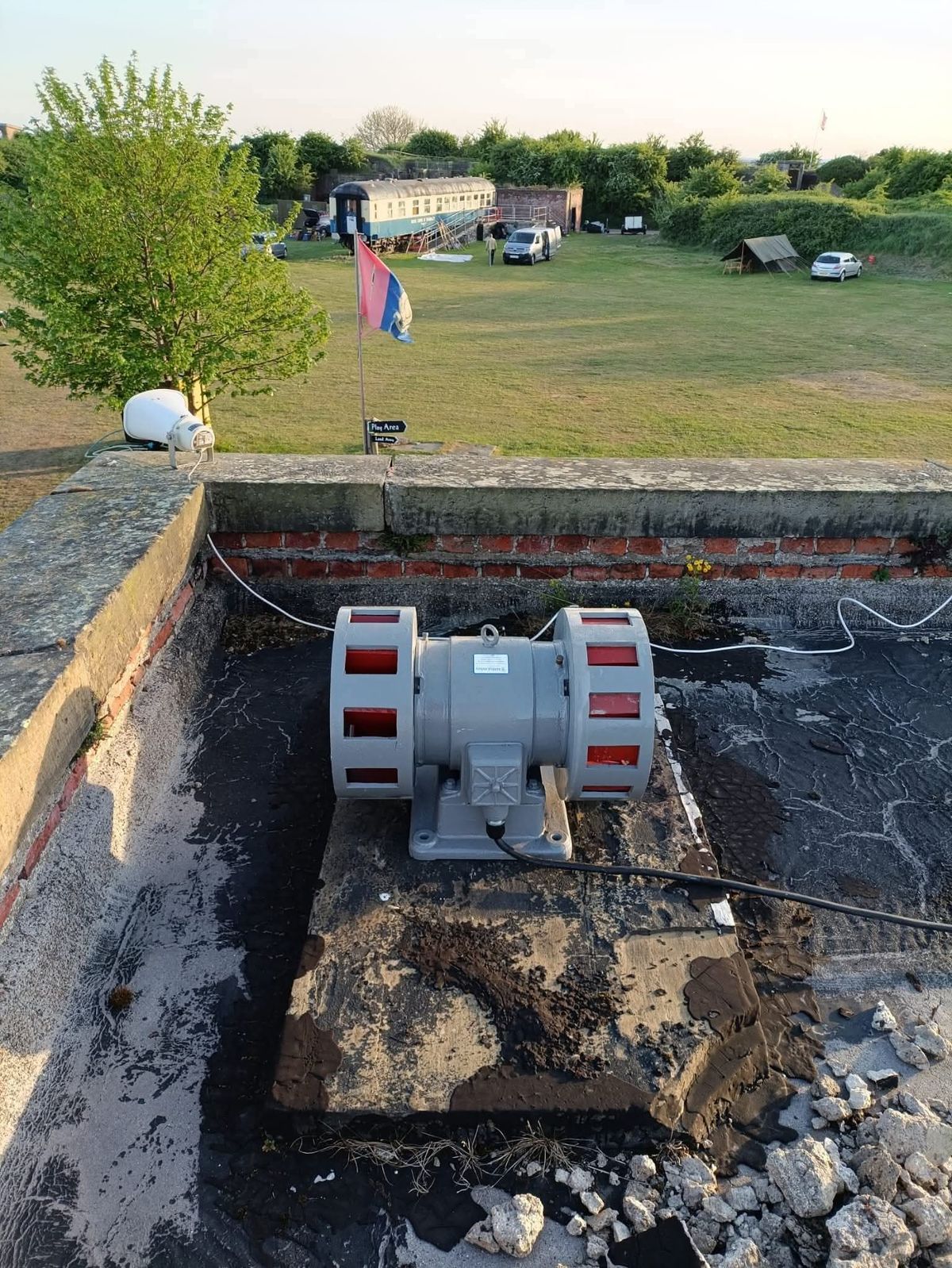 A refurbished WWII air raid siren at Fort Paull Battery Heritage Site sits on top of a building roof