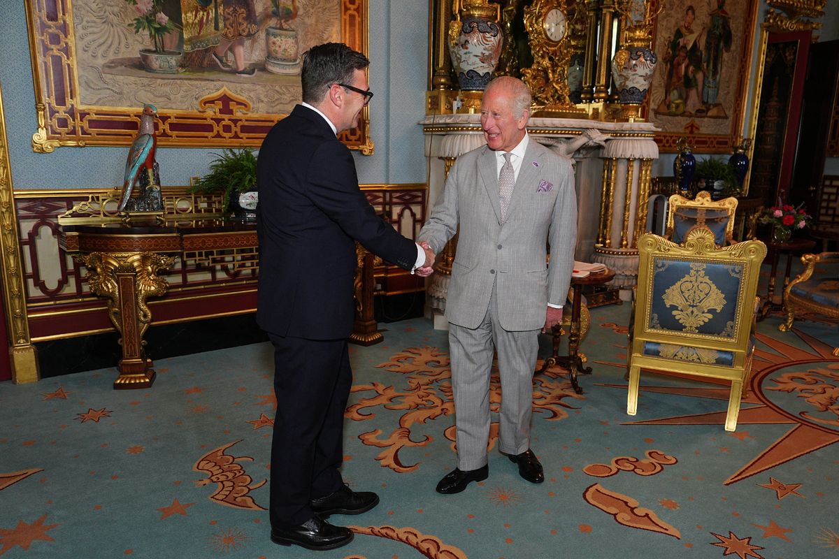 King Charles Britain's King Charles III shakes hands with Britain's incoming Prime Minister Andy Burnham