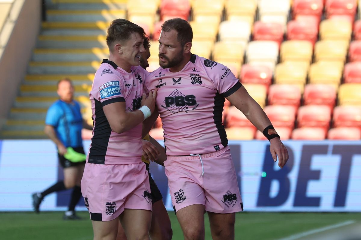Hull FC captain Aidan Sezer celebrates his try with Logan Moy. 