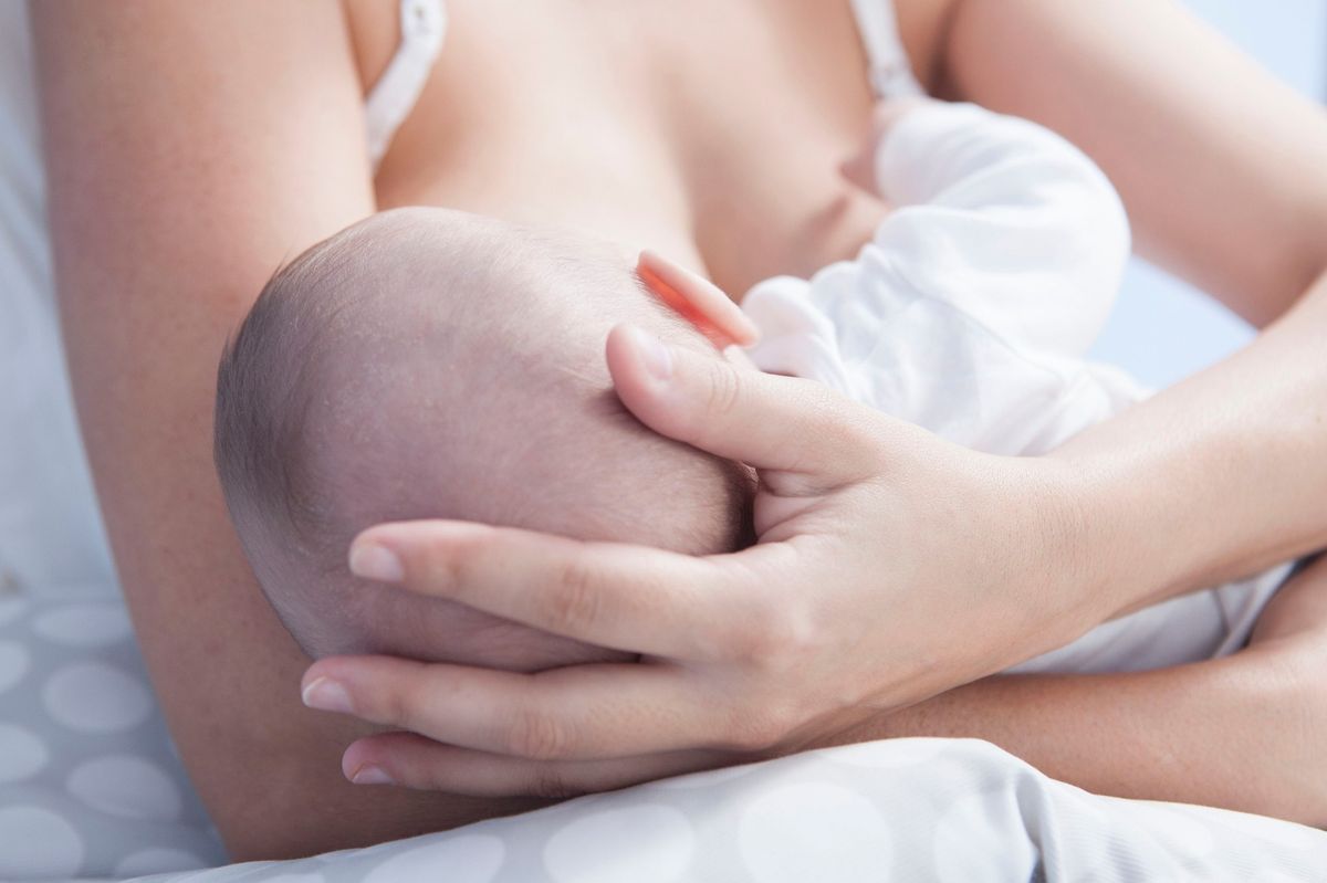 A mother breastfeeding her baby